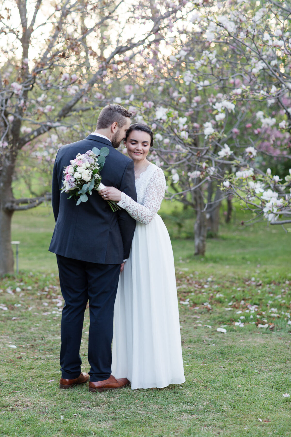 Delve into the whimsical allure of love as Taylor and David find themselves amidst the blooming magnolias, expertly captured by Ottawa Wedding Photographer, Lauren Duffy. In this enchanting portrait, David's affectionate gaze and Taylor's playful smile create a captivating moment of joy. Surrounded by the delicate beauty of magnolia blooms, Lauren Duffy Photography immortalizes the tenderness and connection shared between this delightful couple. Explore the artistry that defines Ottawa weddings with each frame, as Lauren Duffy expertly crafts a narrative of love, playfulness, and natural elegance amidst the magnolia blossoms.