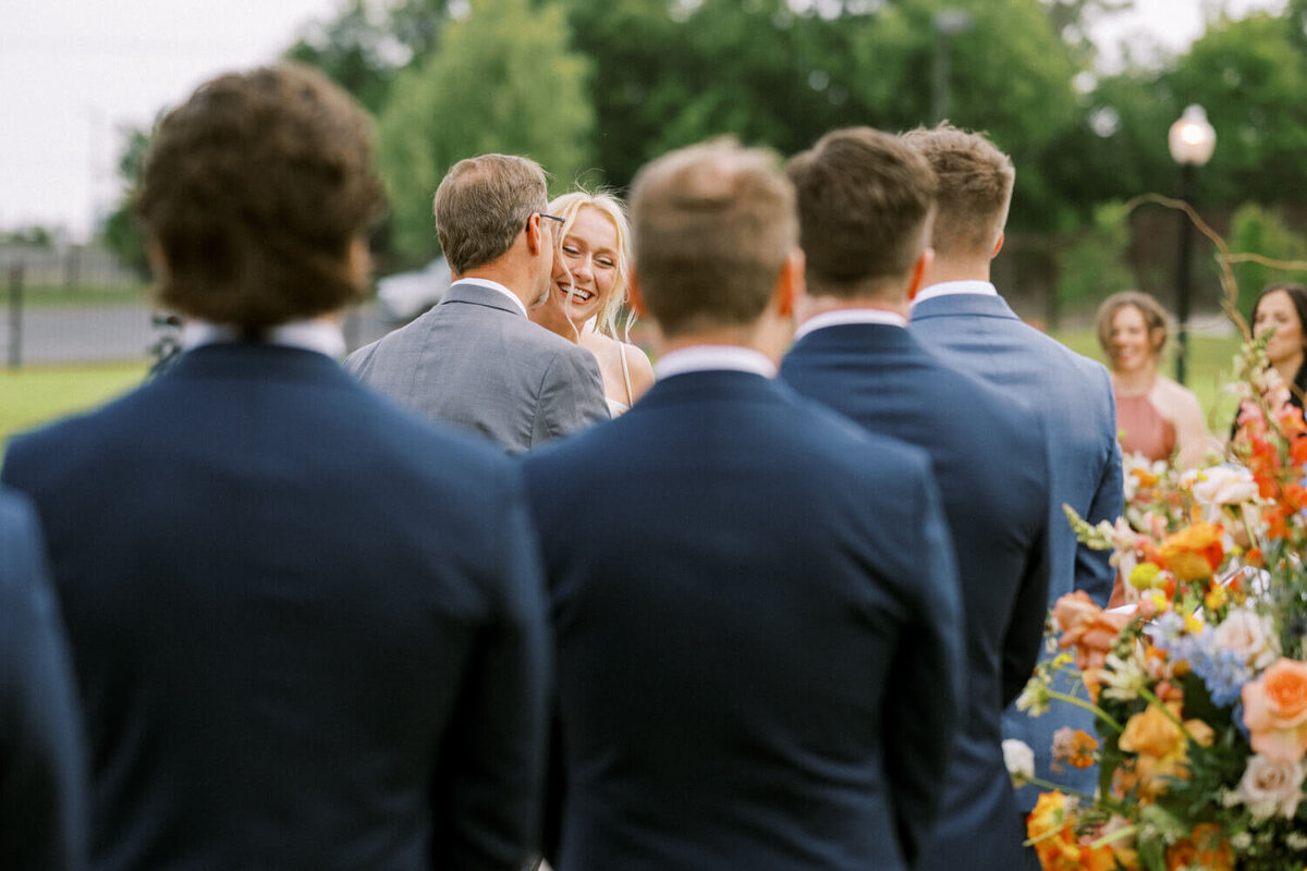 dad-kissing-bride-on-cheek-as-he-gives-her-away