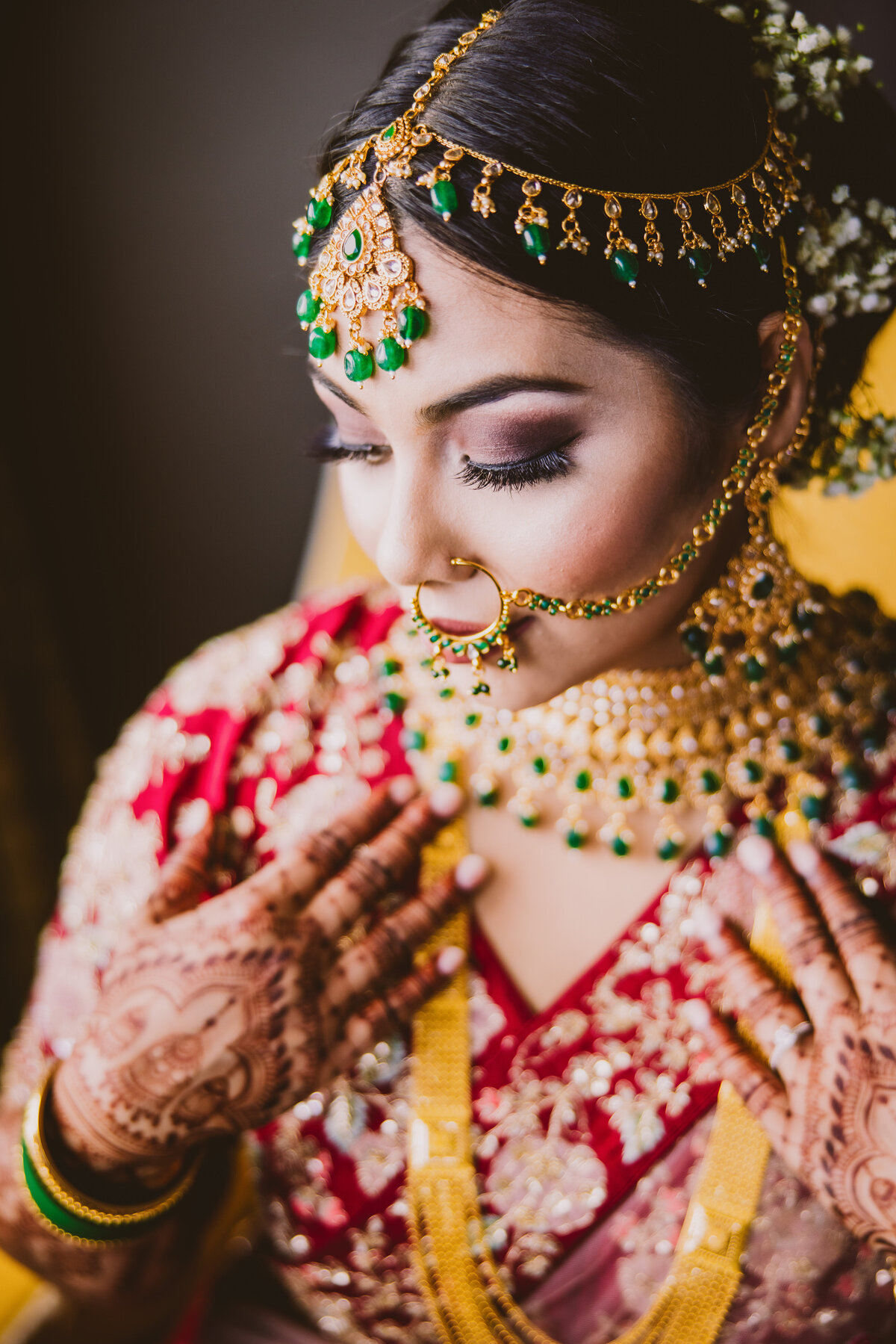 Bengali bride getting ready during bridal prep on the shaadi wedding day