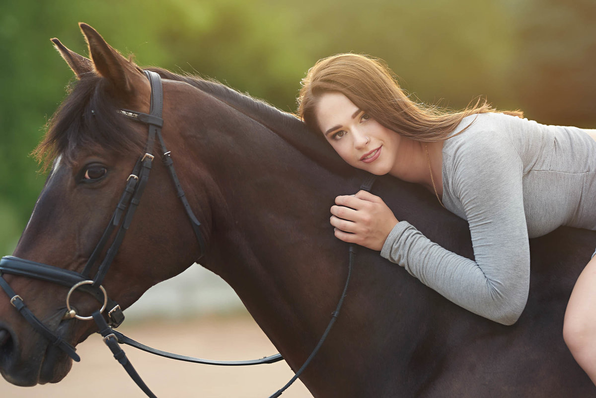 Backlit senior girl on horse minnesota