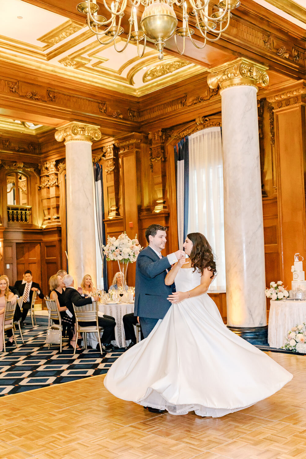 Couple’s first dance in grand ballroom