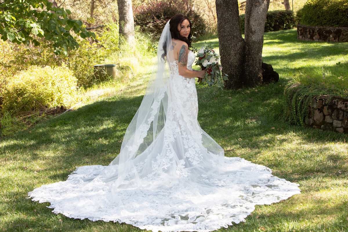 bridal portrait in long lace train and veil