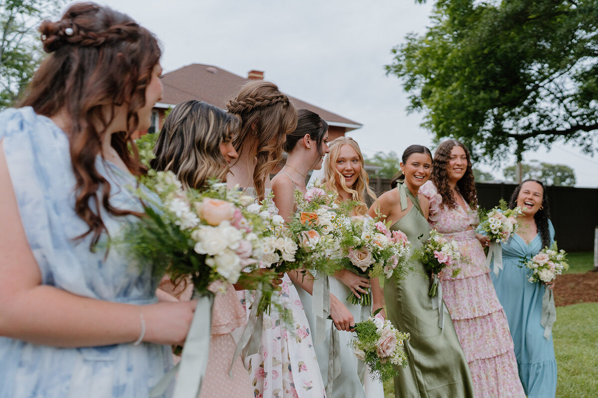 Bride and bridesmaids with bouquets designed by Abby Grace Florals at Easley SC wedding