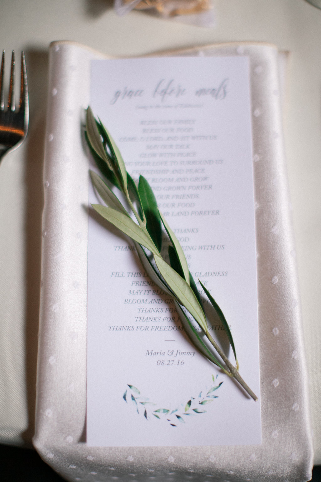 place setting details for a green and white private estate wedding