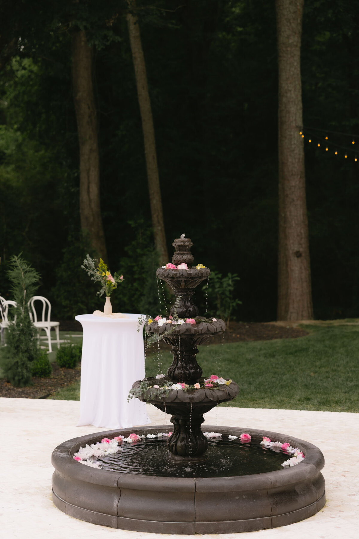 Outdoor fountain decorated with floating flowers