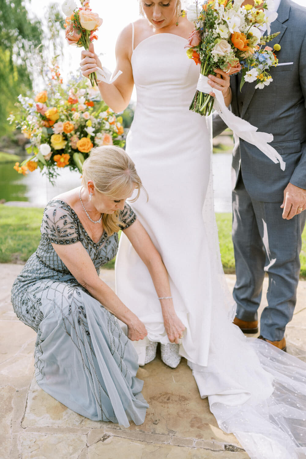 mom-fixing-dress-over-sparkling-boots