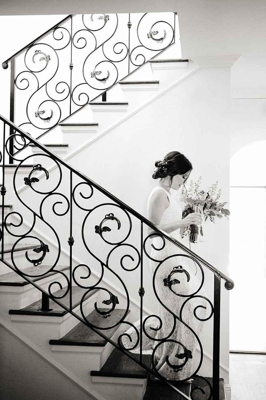 bride is walking down stairs