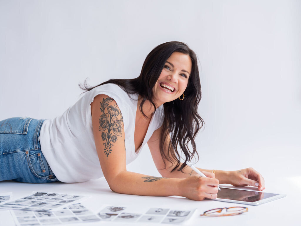 Happy woman smiling sitting on a couch