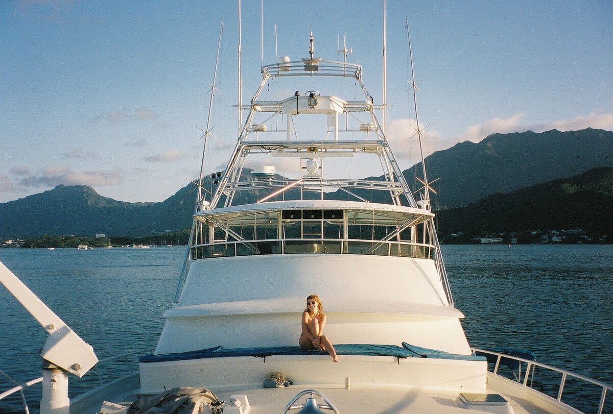 Yacht on the Pacific Ocean captured on film by Kate Winters Photography, showcasing the serene beauty and vast expanse of the ocean in an authentic, documentary style.