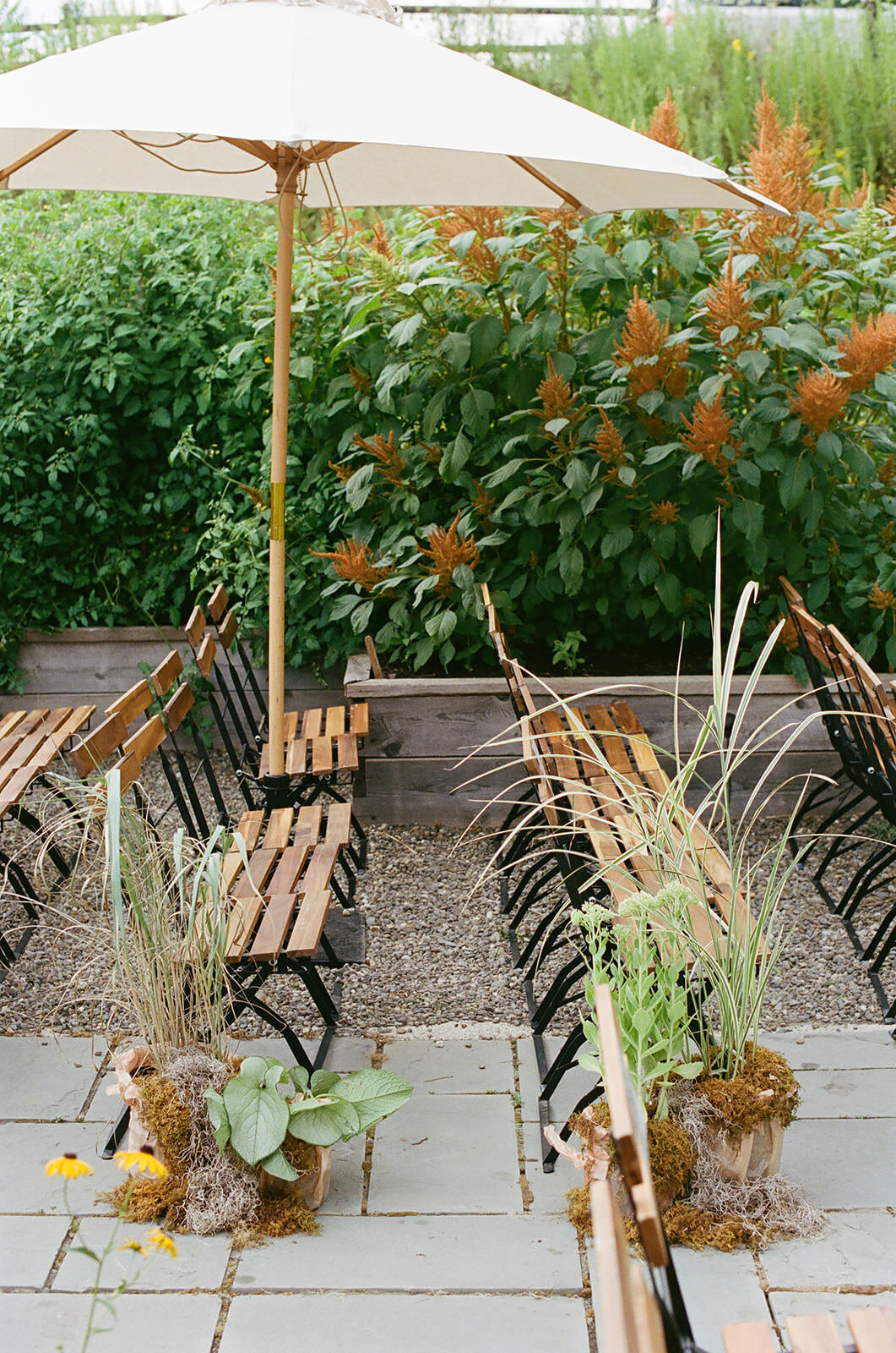 catskills-garden-wedding-ceremony-wood-chairs-white-umbrella