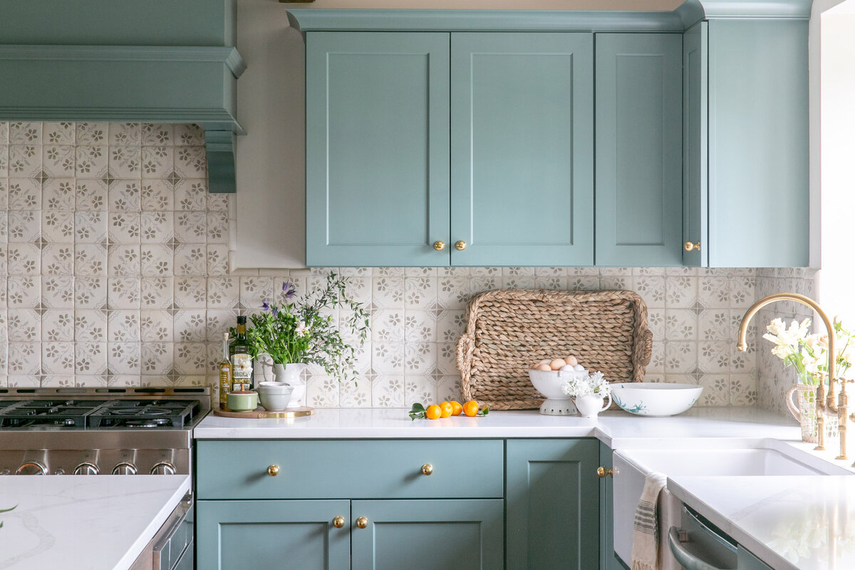 Baby blue kitchen with tiled backsplash at the Rookwood House