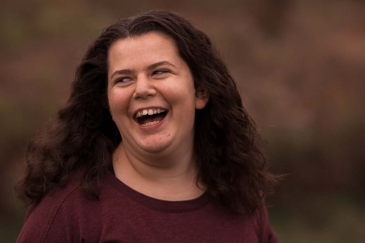 A special needs teen laughs Vermont Senior Portraits