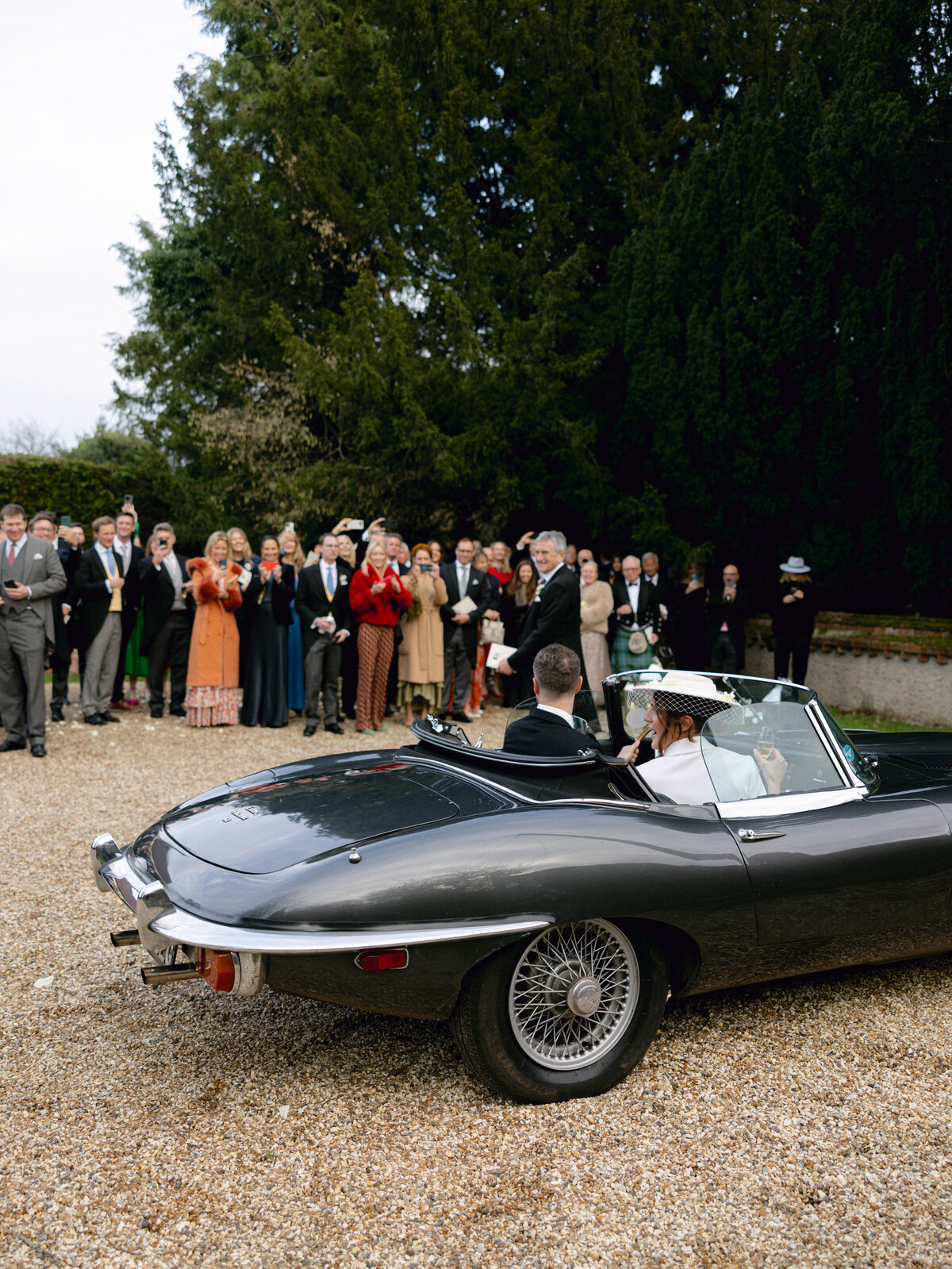Bride and groom in vintage car