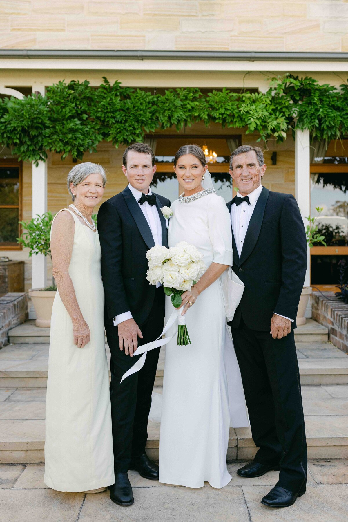 wedding couple with the bride's parents