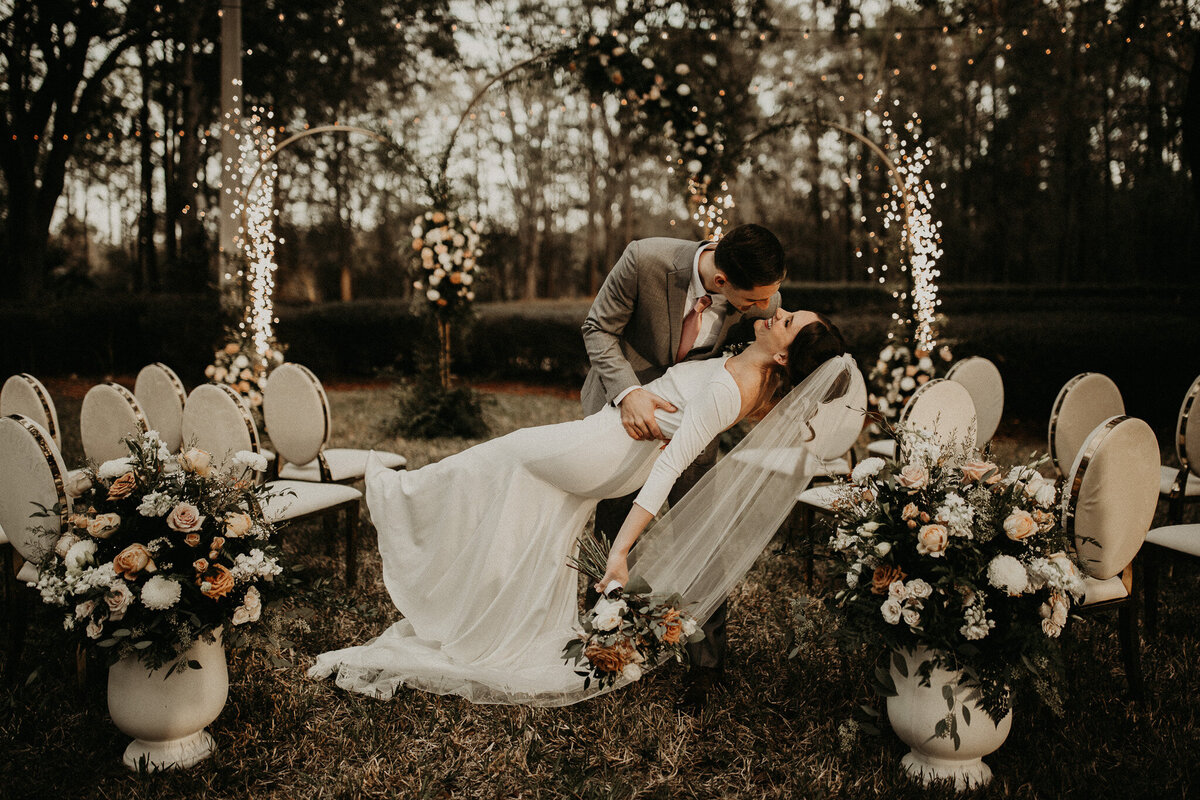 Jacksonville wedding photographer,  florida elopement photographer, garden wedding inspiration, candid wedding photography, bride and groom kissing after saying "ido" at their wedding ceremony.