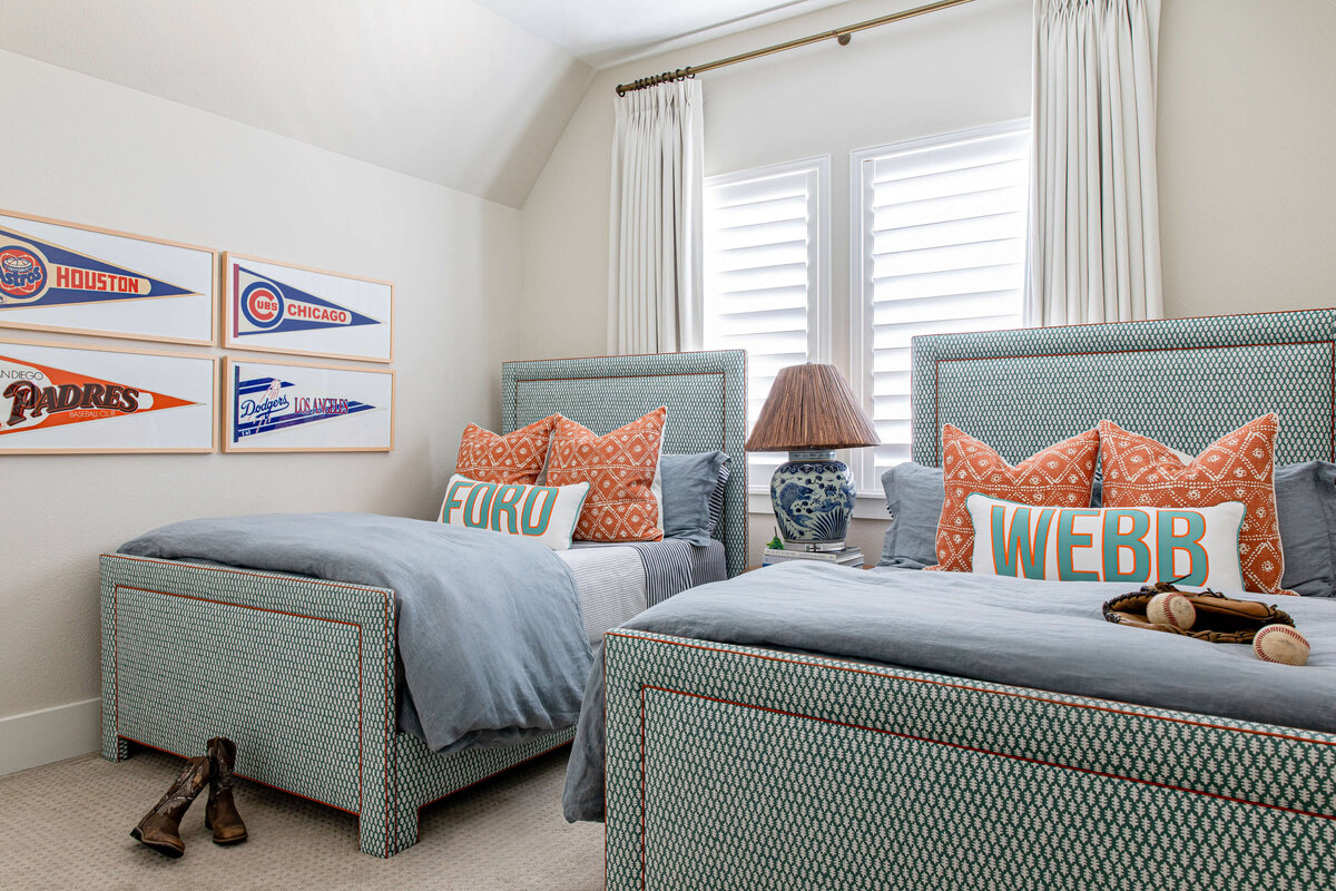 oyster creek stuidios aryns home two beds with oriental lamp and sports decor in bedroom