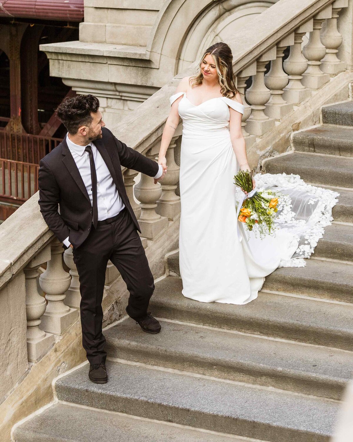 44-Chicago-riverwalk-stairs-bride-groom