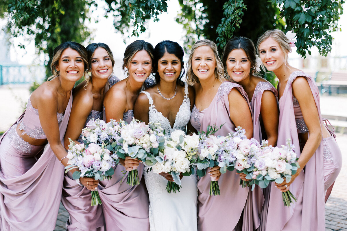 bride squad posing for a photo smiling