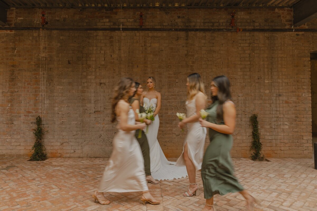 bridal party poses for portraits after wedding in arizona