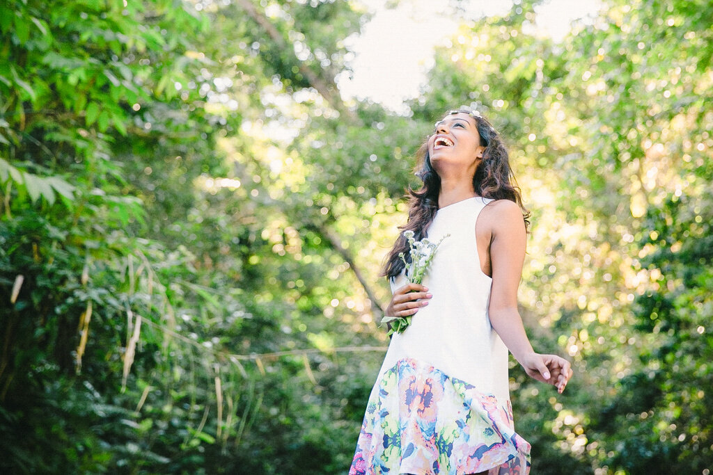 happy girl laughing in the trees