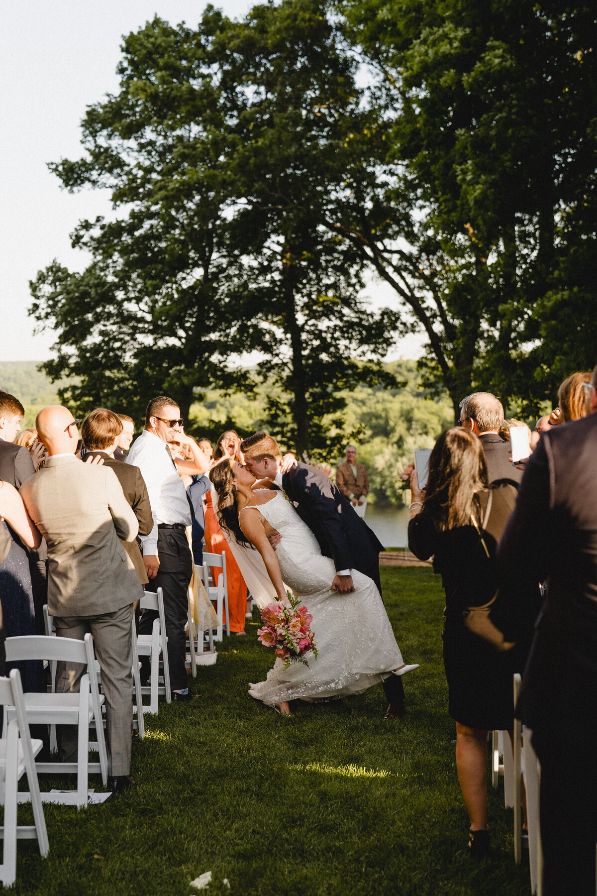 wedding-ceremony-aisle-dip-kiss-at-saint-clements-castle