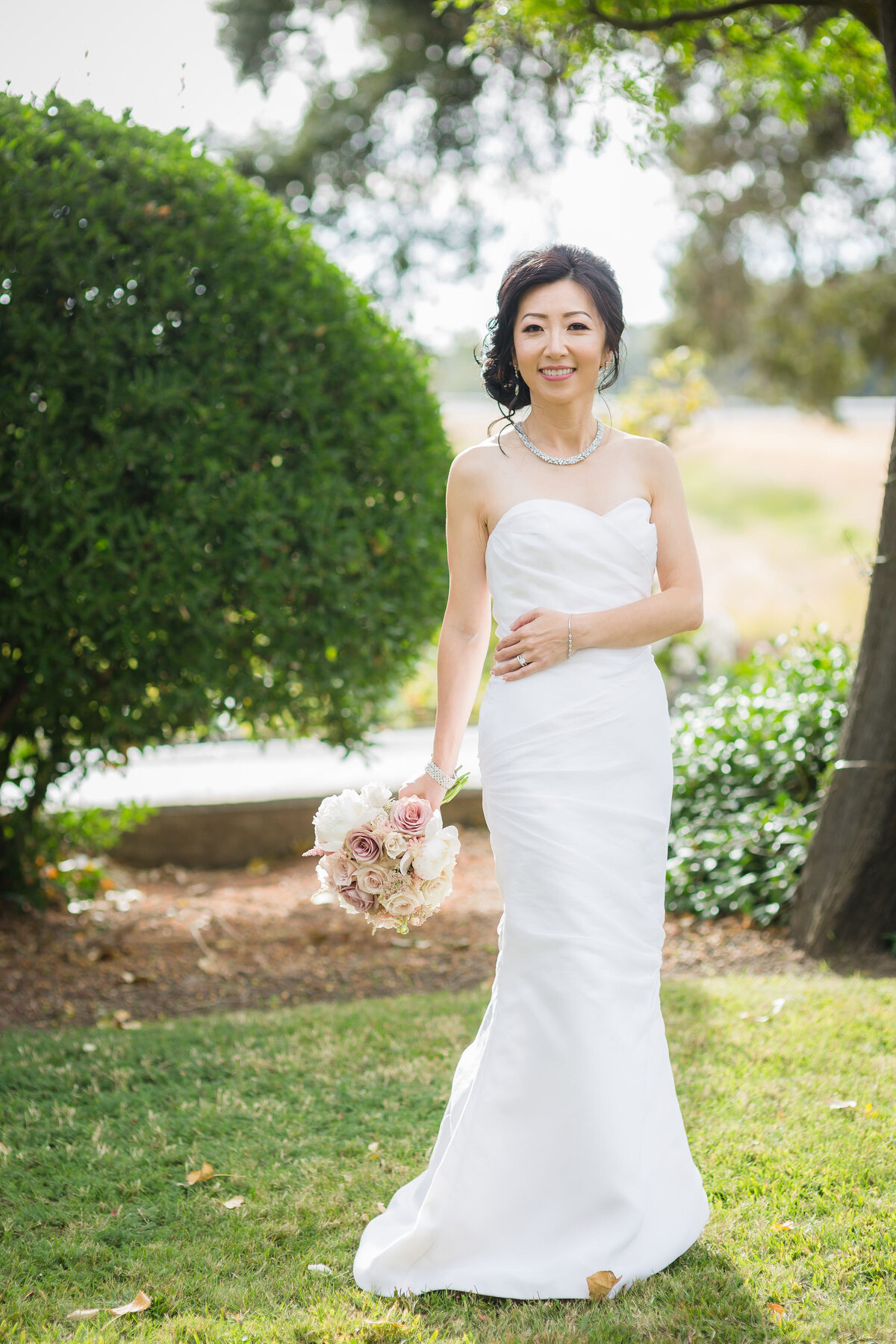 bride standing on Scribner bend lawn