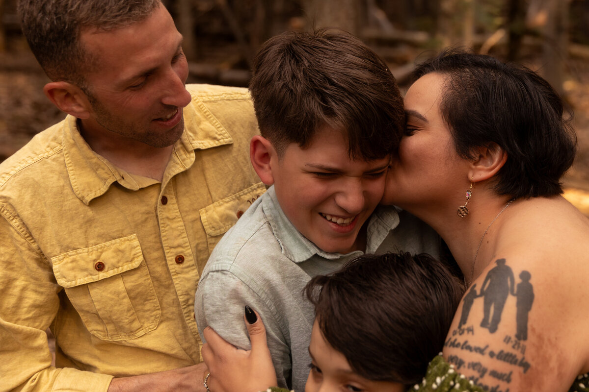 Family hugging during an outdoor session in Utah with Lamblight Photography