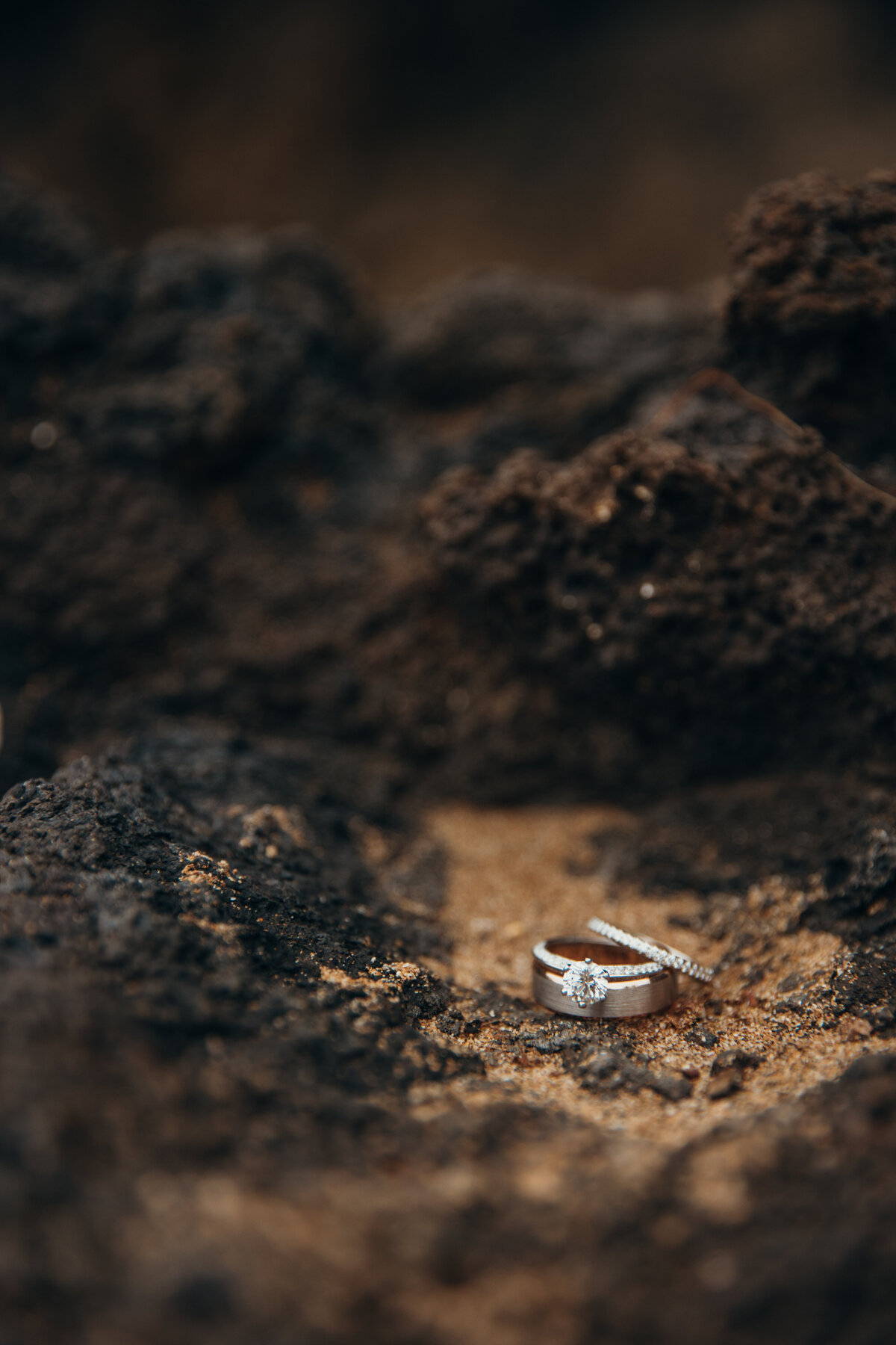 Maui Wedding Photographer captures wedding rings in the sand after Maui beach wedding