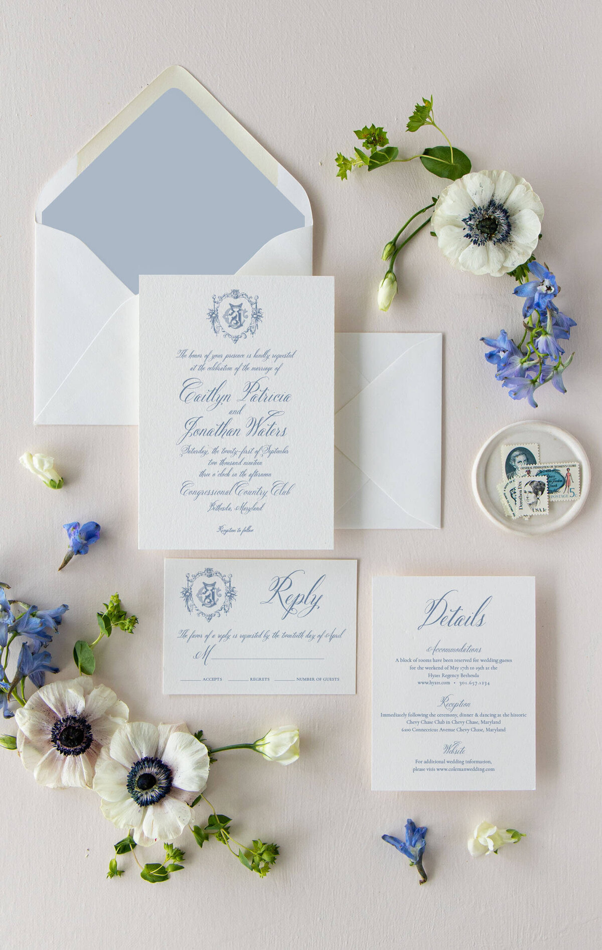 Classic wedding invitation suite with blue florals and blue accents.