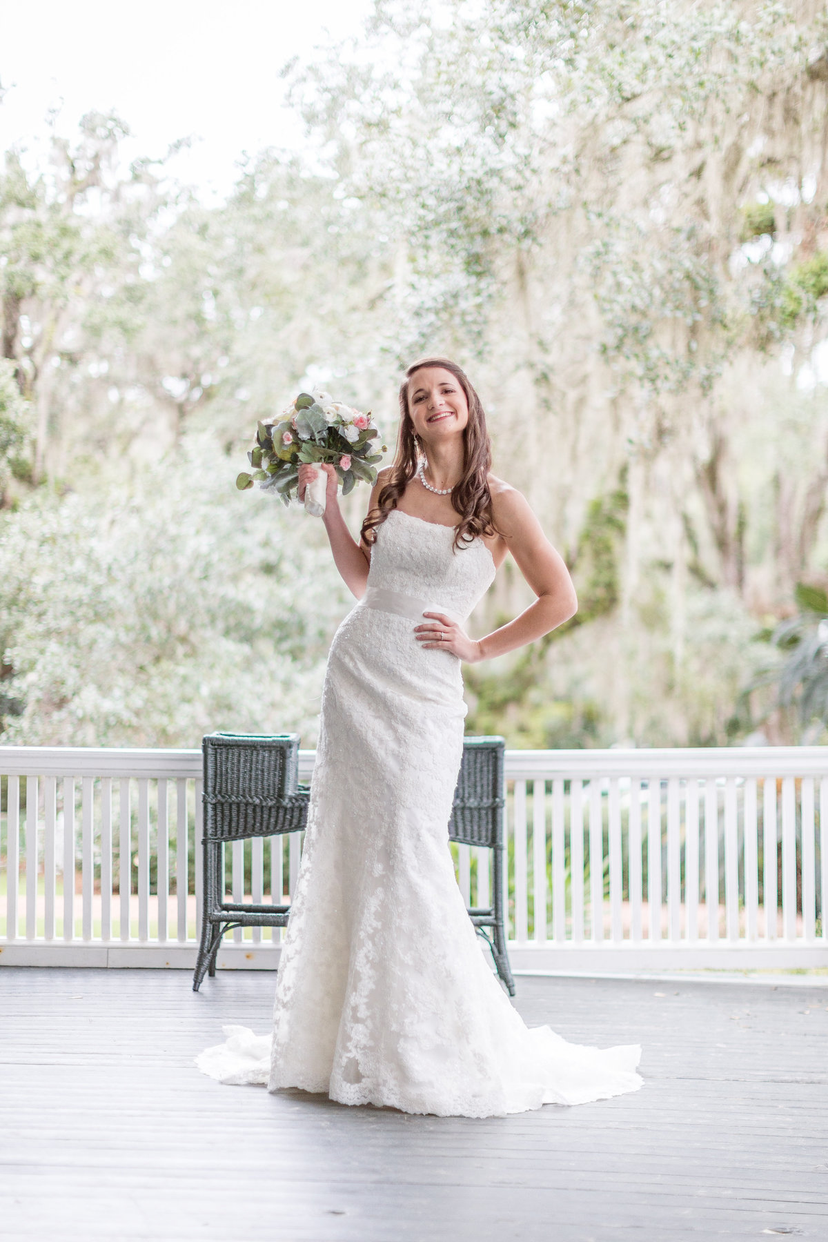 Bride blowing a kiss at the camera during her portrait session at Goodwood House and Museum in Tallahassee, Florida.