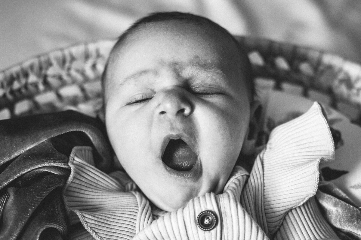 yawning baby in black and white