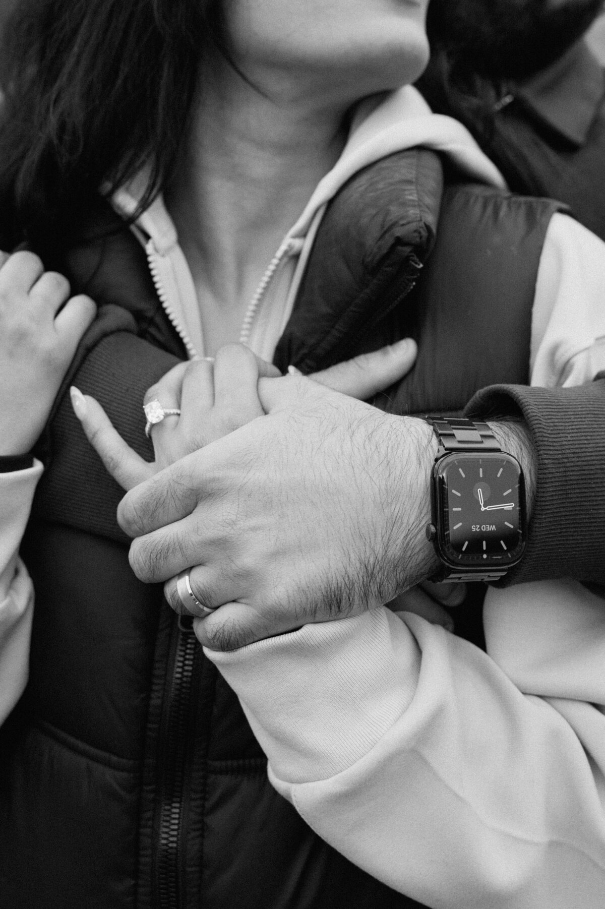 woman also gave her boyfriend an engagement ring - black and white close up shot of both engagement rings. 