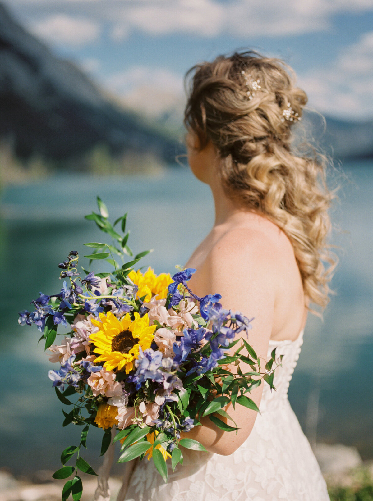 Classic bridal portrait with stunning wildflowers captured by Pam Kriangkum Photography, fine art, classic wedding photographer in Edmonton, Alberta. Featured on the Bronte Bride Vendor Guide.
