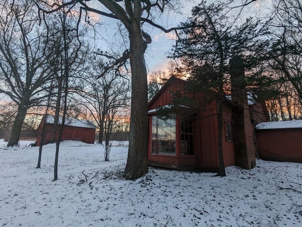 a small cabin on a snowy winter day