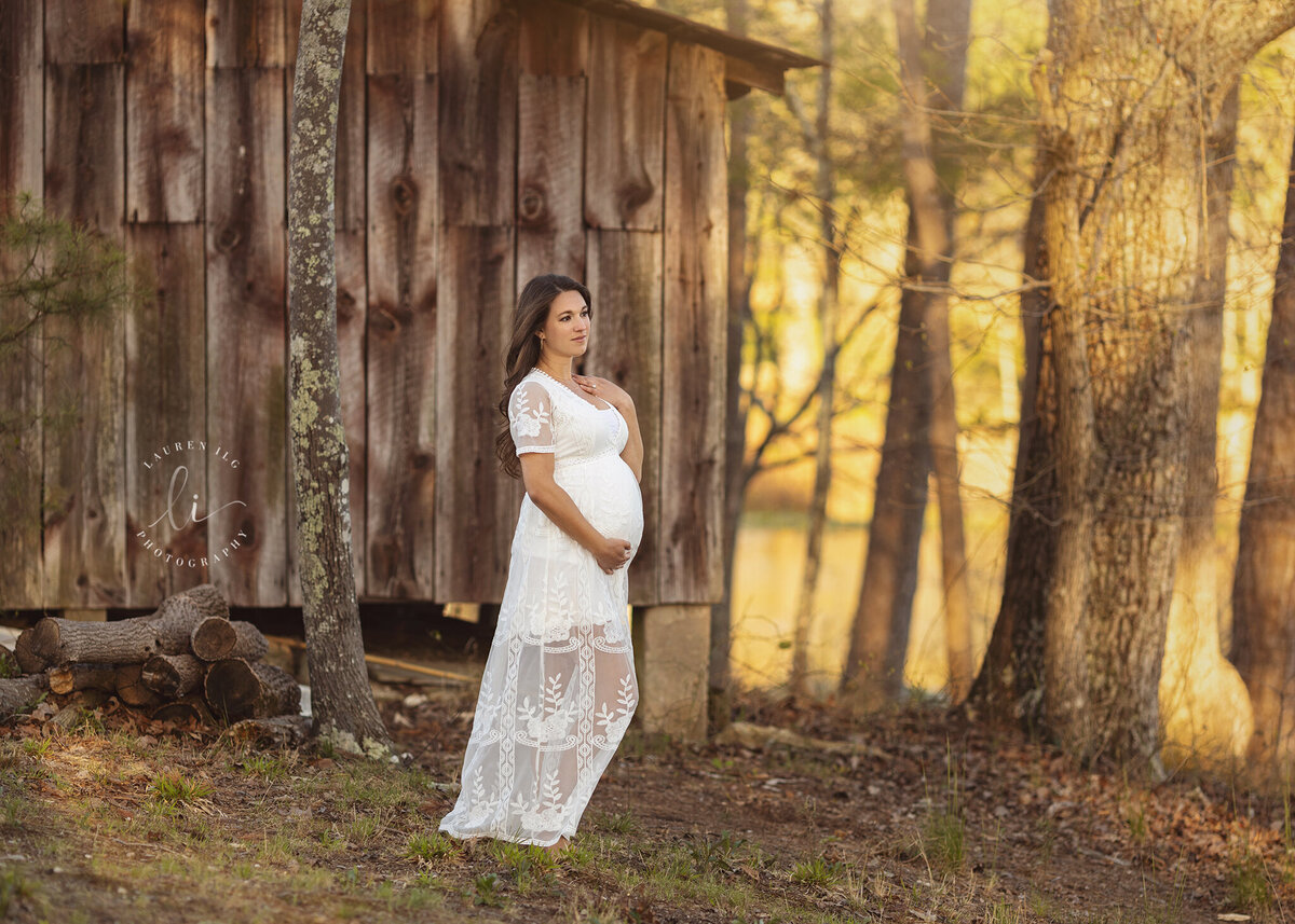 Sunset maternity session at Murrays Mill by rustic barn