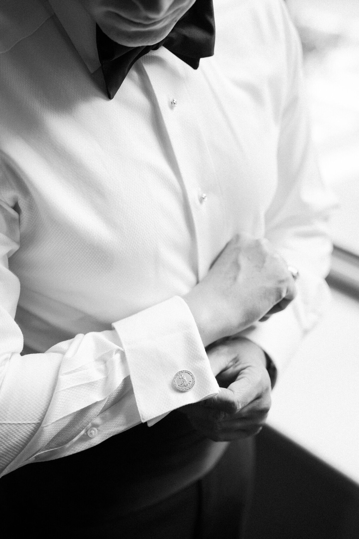 John Marshall Hotel Wedding | groom adjusting his cufflinks