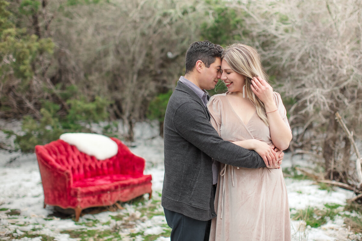 red couch velvet dress winter engagement photographer  in New Braunfels snow