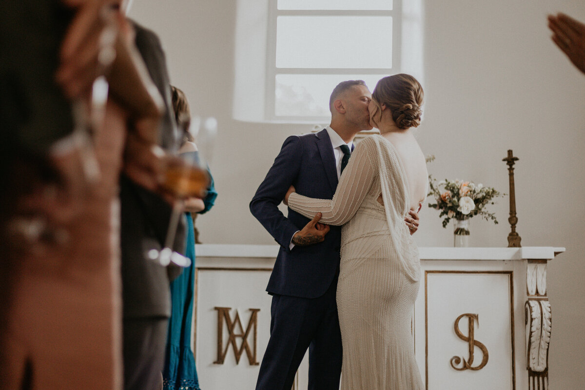 bride and groom in the small chapel at Bishop's Lodge Santa Fe for their ceremony