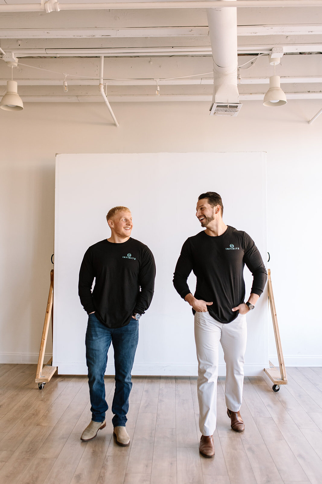 Creative business owner laughing during casual DFW branding session.