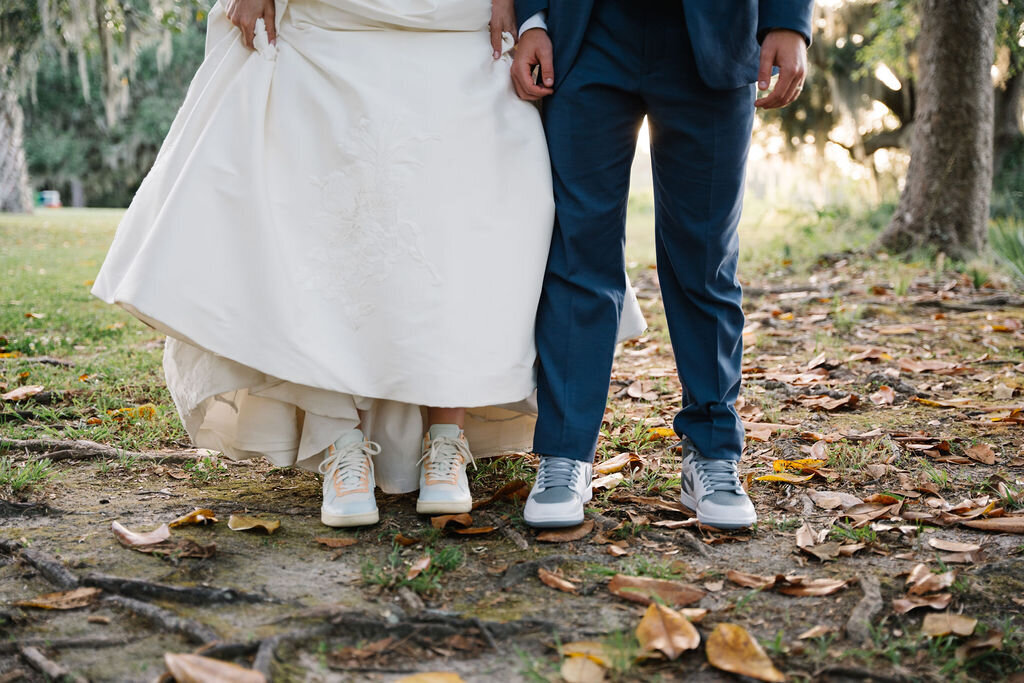 Bride and groom wearing coordinating sneakers