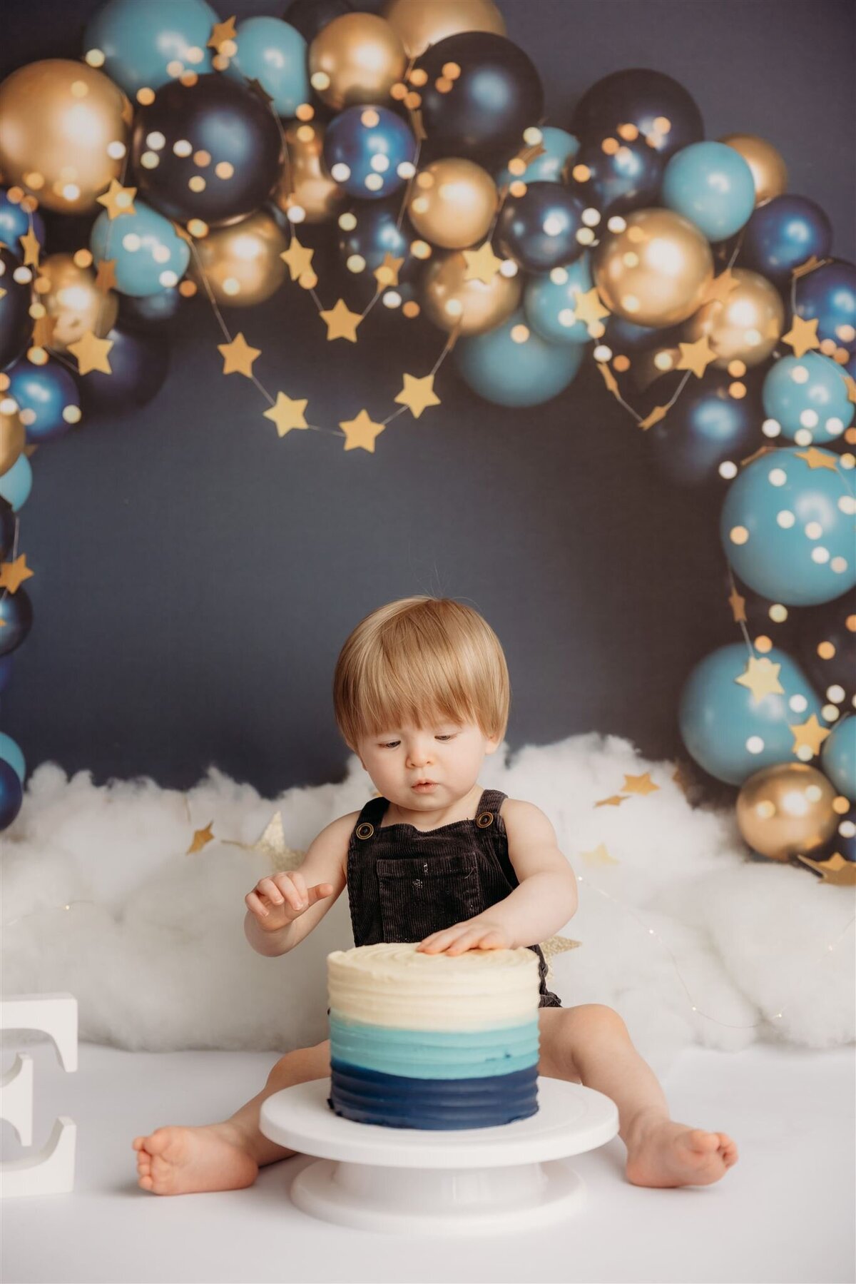 Torben during his cakesmash photoshoot with auckland photographer michelle kelly