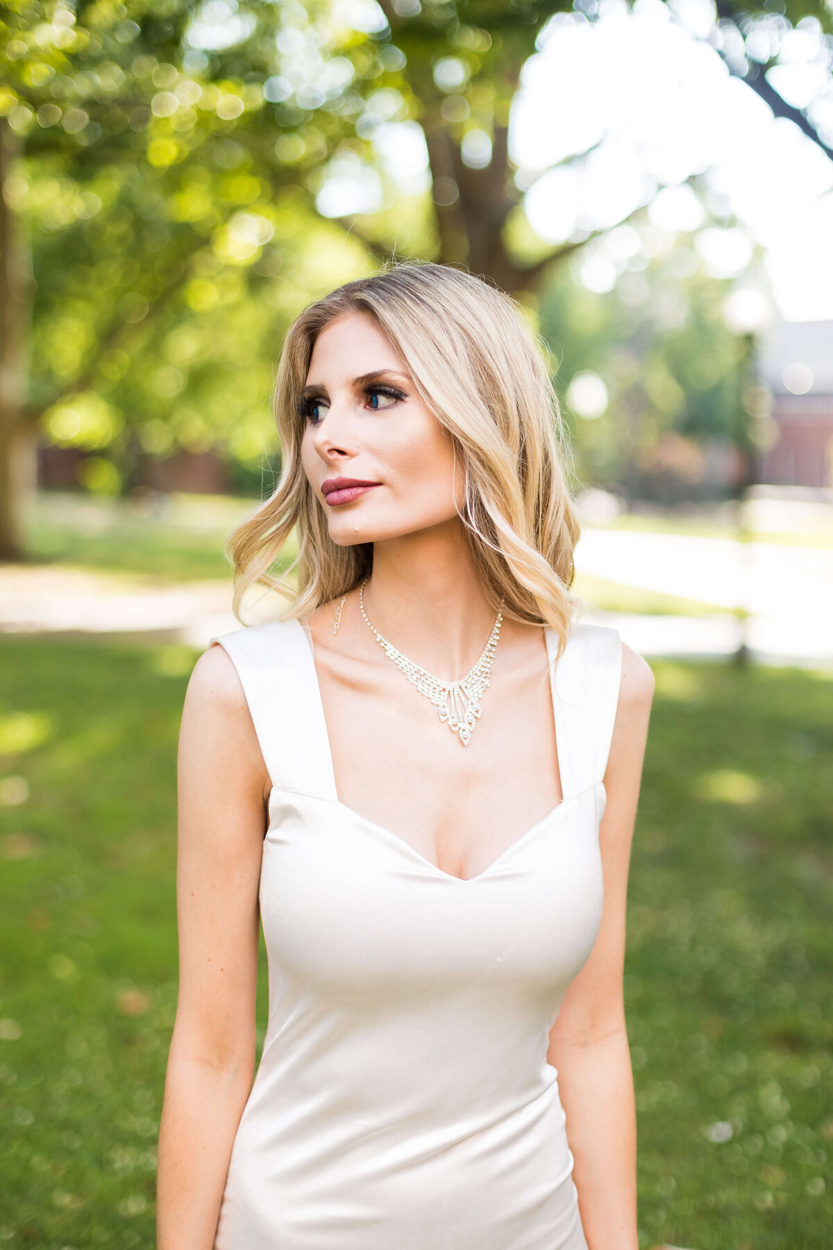 Bride wearing white fitted silk dress at Vanderbilt Alumni Hall, Nashille