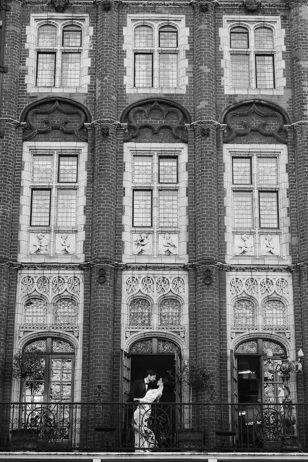 Milestone Hotel in Kensington London, a couple kiss on the balcony.