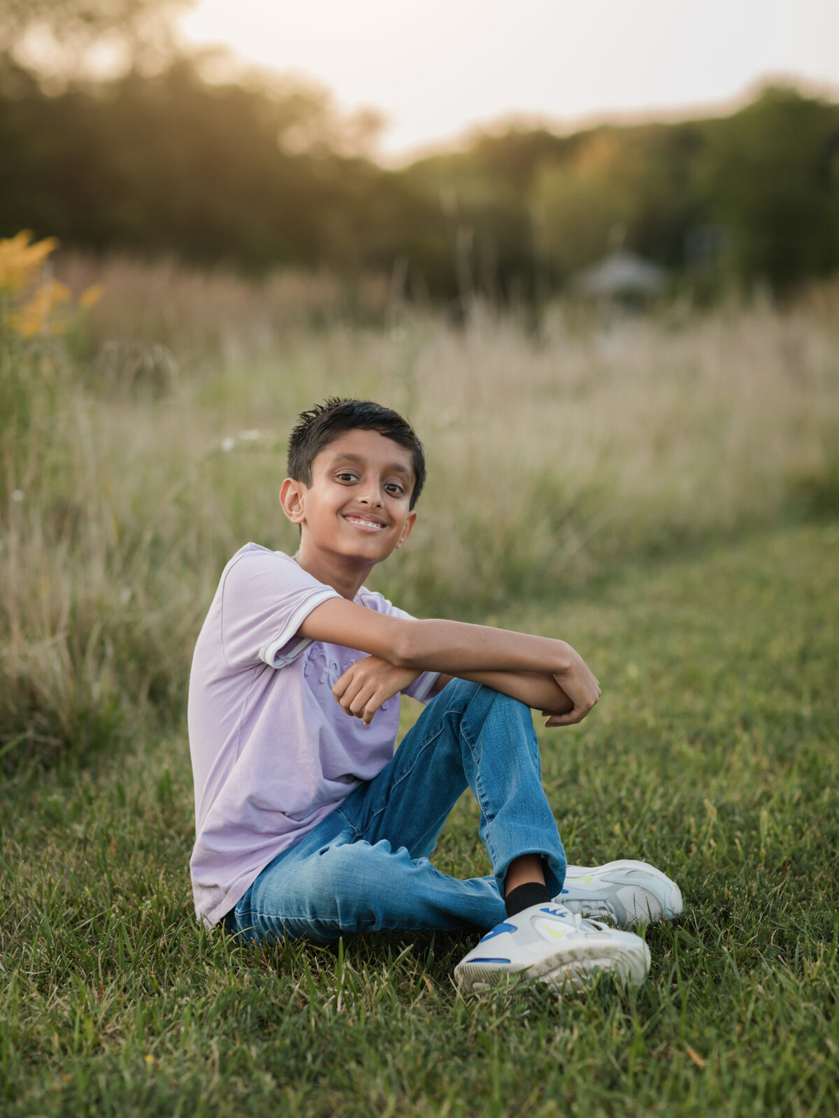 boy posed for family photos in field