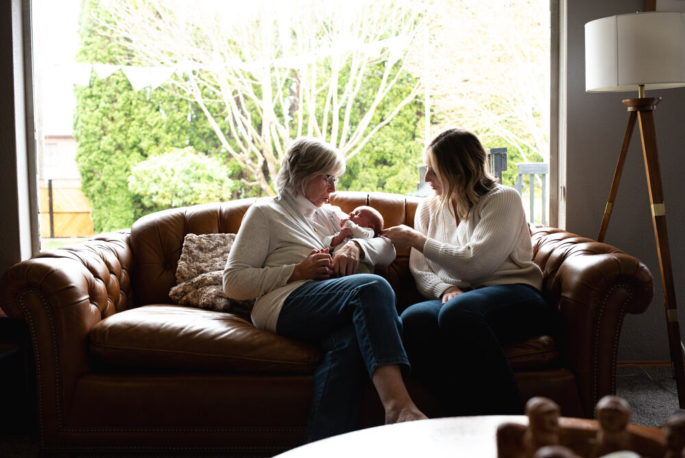 family photo jeans indoor photo on couch large window