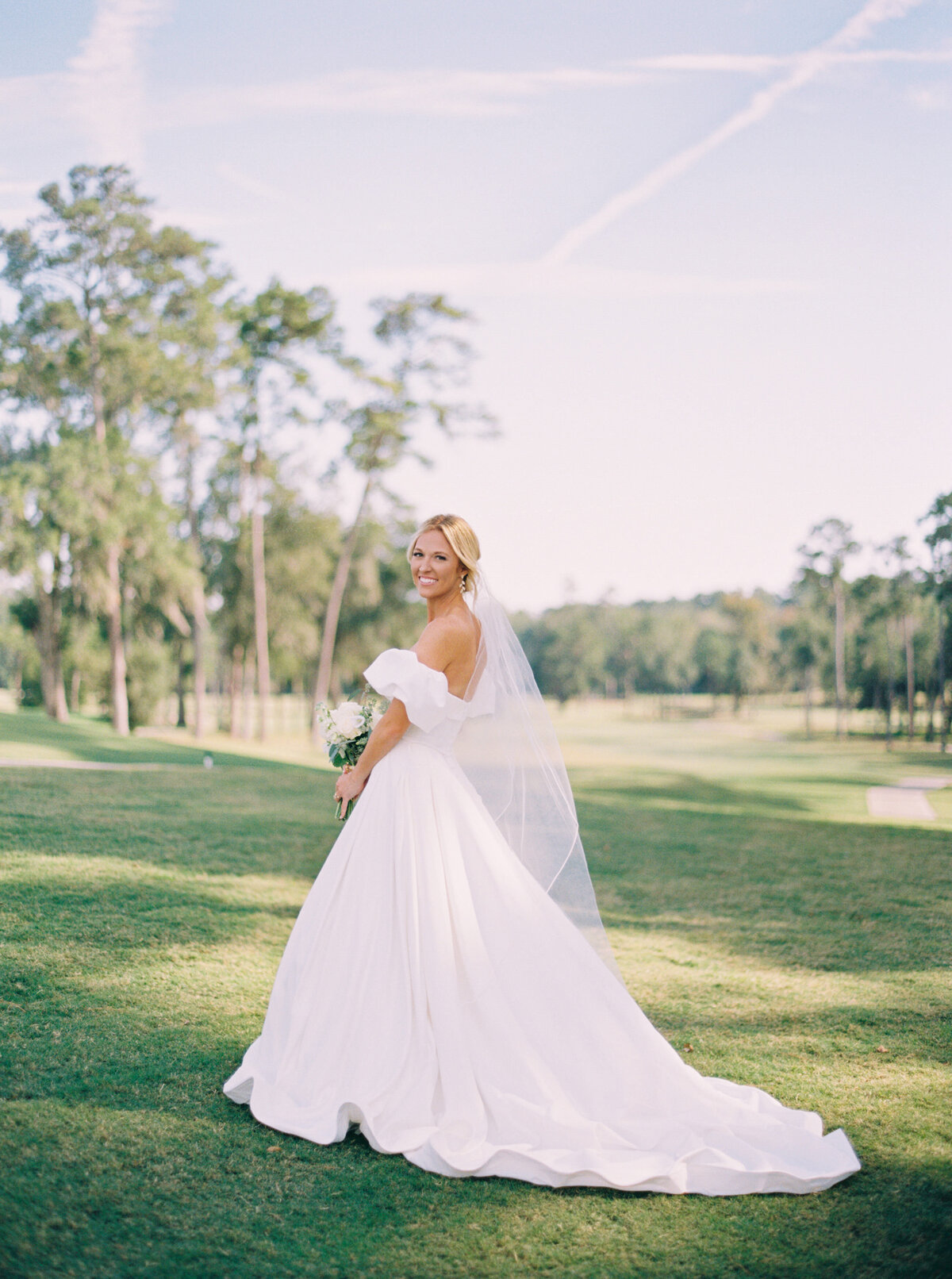 Stunning bridal portrait on a golf course