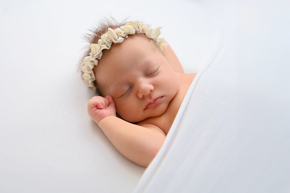 newborn baby girl on a white background.