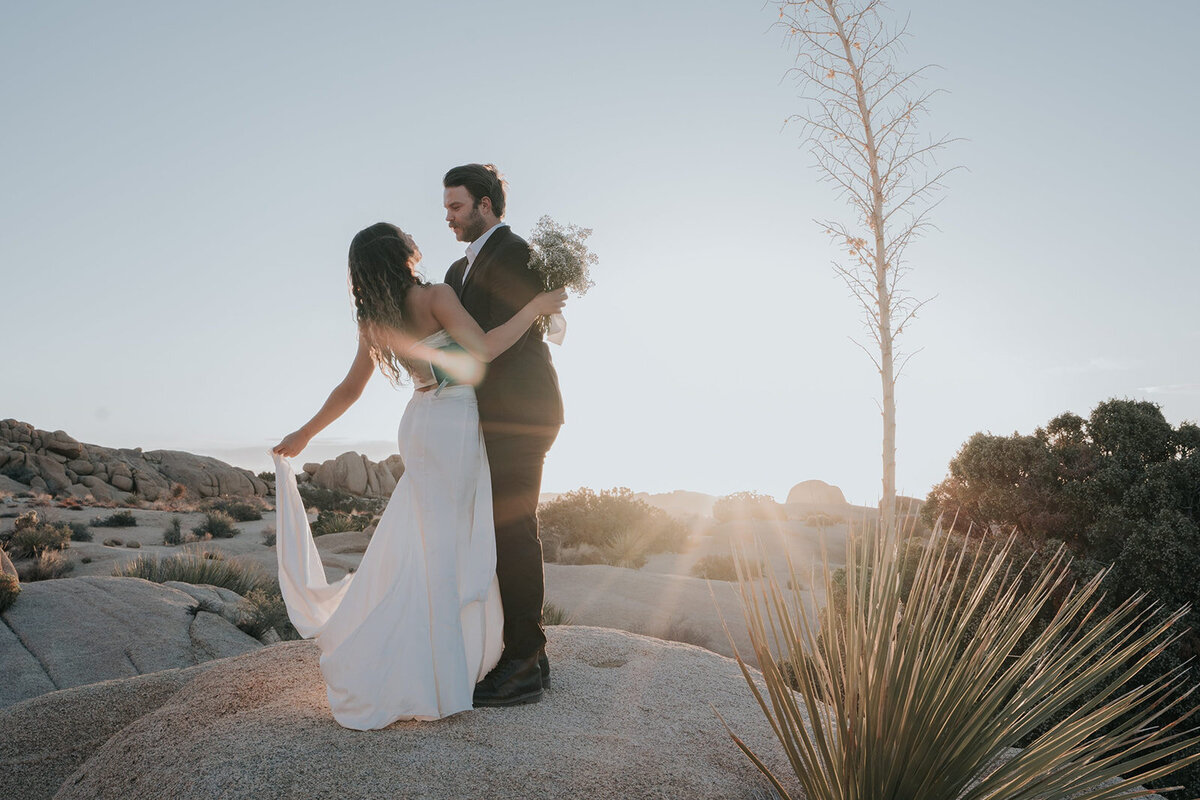 Newly weds standing in the sun for bridal portraits. 