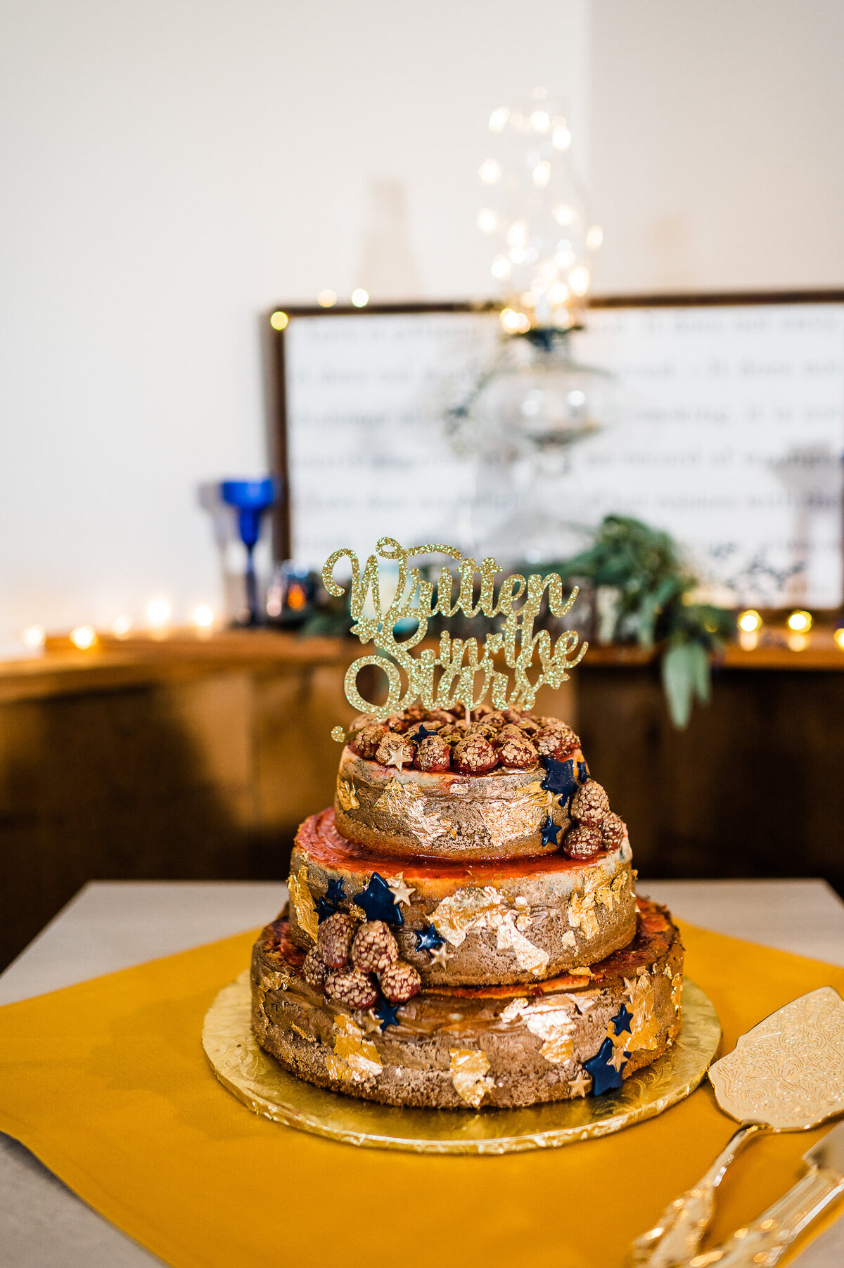 three tier wedding cake with gold stars and blue accents for Richmond weddings