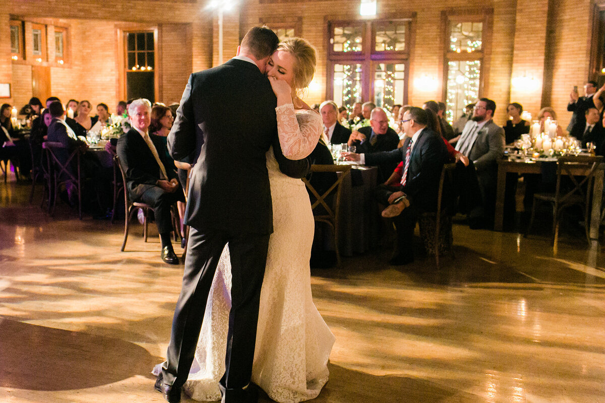 Bride and groom share a romantic first dance at their wedding reception at Cafe Brauer in Chicago.